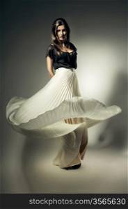 pretty woman with long flying skirt