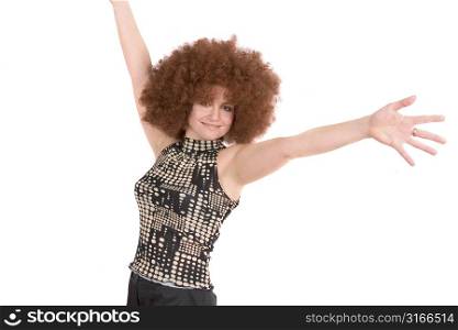 Pretty woman with red afro wig and her arms spread out