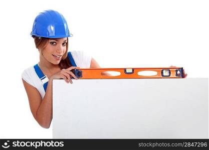 pretty worker girl showing her tool
