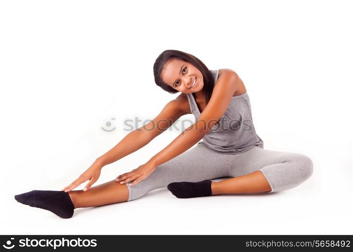 Pretty young african woman doing exercise