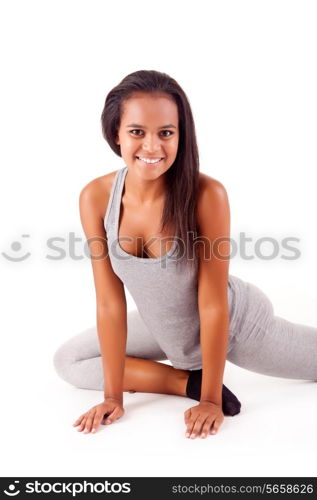 Pretty young african woman doing exercise