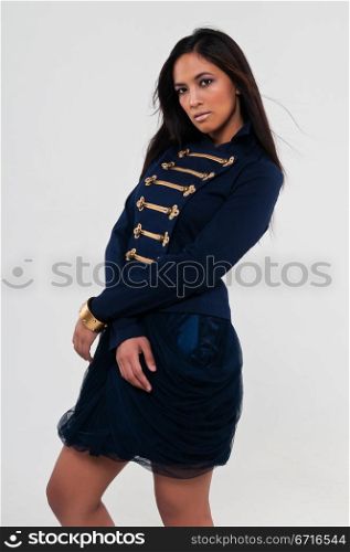 Pretty young Asian woman in a navy jacket and skirt