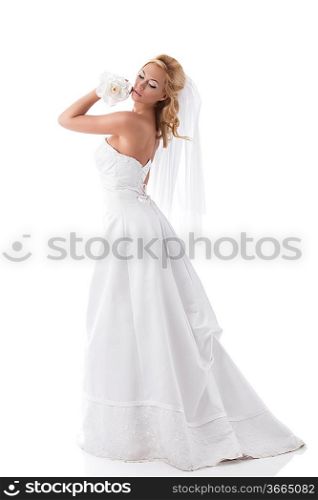 pretty young blonde bride with long wedding dress and veil, looking her back. isolated on white background