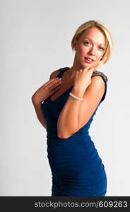 Pretty young blonde in a blue dress