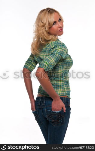 Pretty young blonde woman in a green plaid shirt and jeans