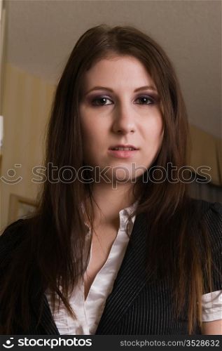 Pretty young brunette in a business suit