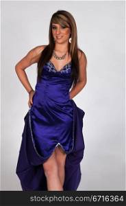 Pretty young brunette in a long blue gown