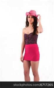 Pretty young brunette in a purple bustier and pink skirt