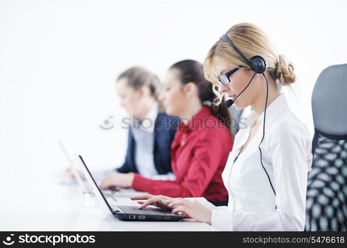 Pretty young business woman group with headphones smiling at you against white background