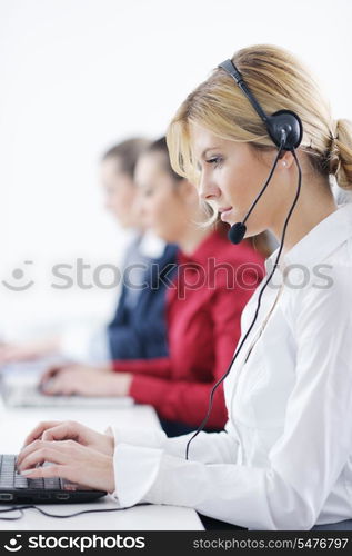 Pretty young business woman group with headphones smiling at you against white background