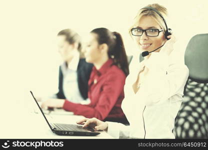 Pretty young business woman group with headphones smiling at you against white background