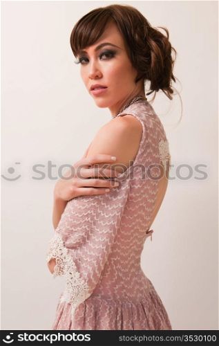 Pretty young Chinese woman in a pink dress