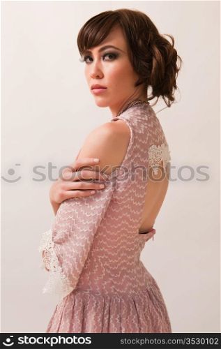 Pretty young Chinese woman in a pink dress