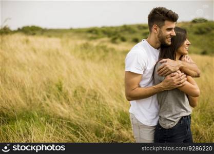 Pretty young couple in love outside in spring nature
