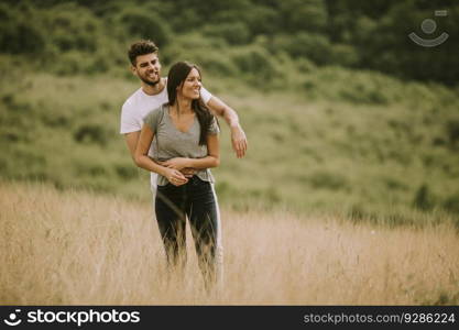 Pretty young couple in love outside in the spring nature