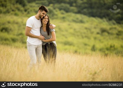 Pretty young couple in love outside in the spring nature