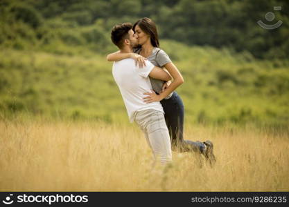 Pretty young couple in love outside in the spring nature