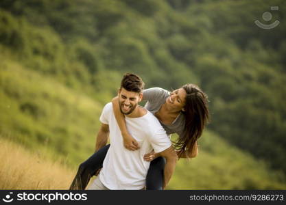 Pretty young couple in love outside in the spring nature