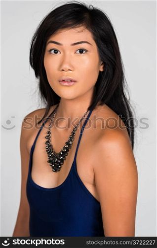 Pretty young Filipina in a spaghetti strap blue dress