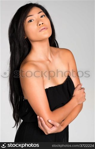 Pretty young Filipina in a strapless black dress