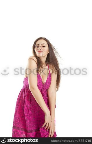 Pretty young girl in red dress posing in studio isolated on white