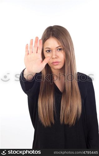 Pretty young girl making stop sign isolated on a white background