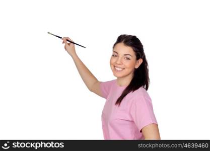Pretty young girl with a brush painting something isolated on white background