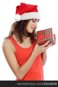 Pretty young girl with christmas box and santa hat