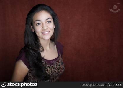 Pretty young Hispanic woman in a studio