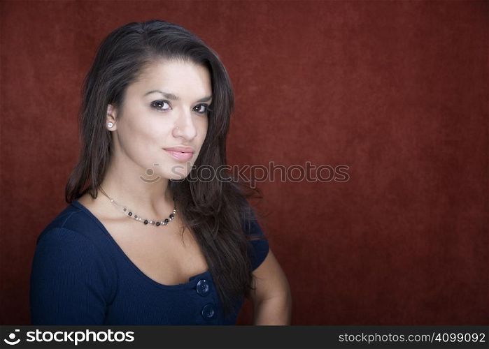 Pretty young Hispanic woman in a studio