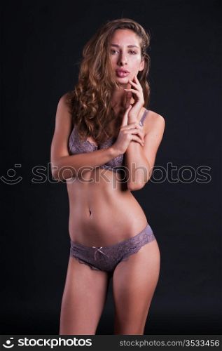 Pretty young Israeli woman in mauve lingerie