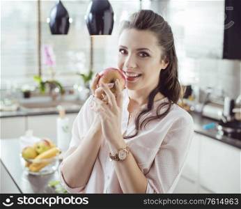Pretty, young lady holding an apple
