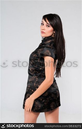 Pretty young multiracial woman in a Chinese dress