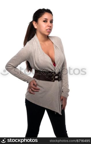 Pretty young petite Latina in a gray sweater and black jeans