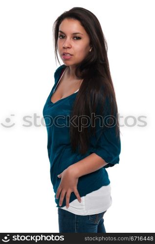 Pretty young petite Latina in a teal blouse and jeans