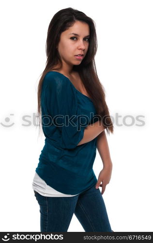 Pretty young petite Latina in a teal blouse and jeans