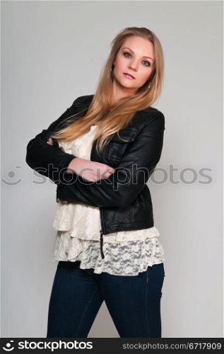 Pretty young plus size blonde in a frilly blouse