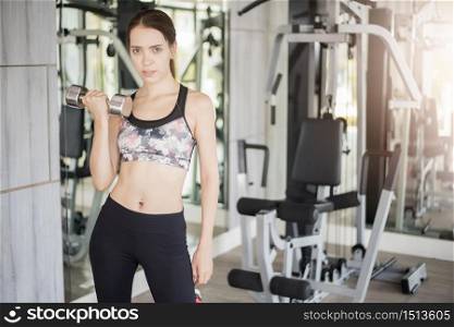 Pretty young sport woman is Workout in gym, Healthy lifestyle