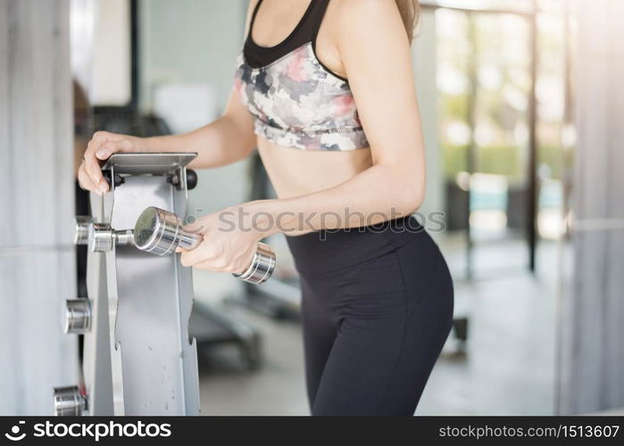 Pretty young sport woman is Workout in gym, Healthy lifestyle