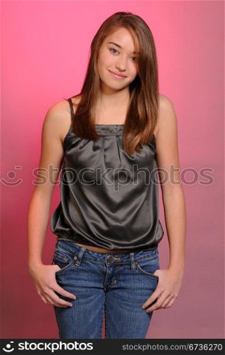 Pretty young teenage girl with long brown hair