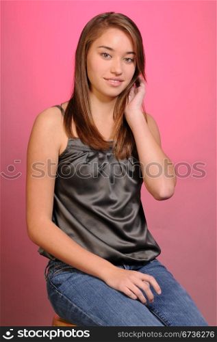 Pretty young teenage girl with long brown hair