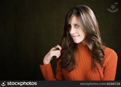 Pretty Young Woman Biting Her Lip and Twirling Her Hair