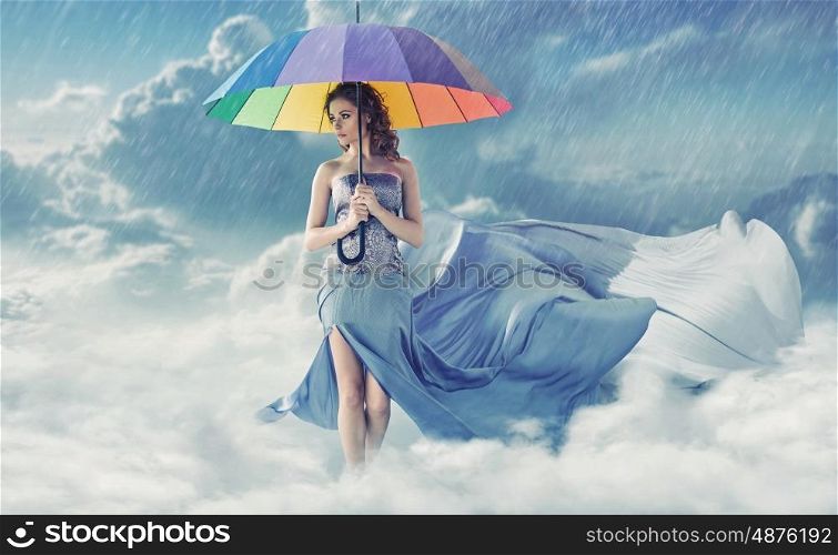 Pretty young woman during rainy weather