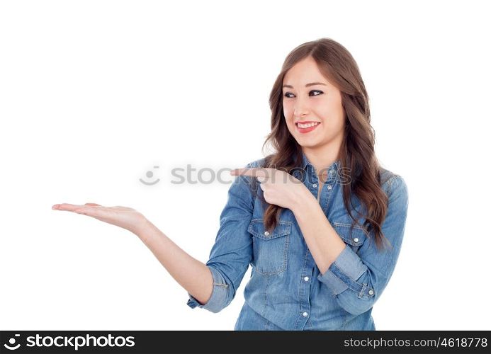 Pretty young woman indicating something with the finger isolated on a white background