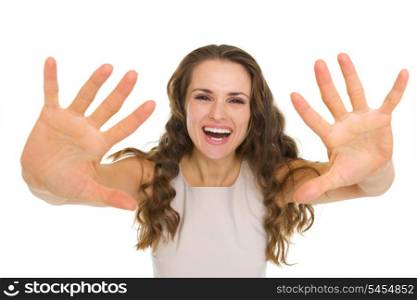 Pretty young woman pulling hands in camera