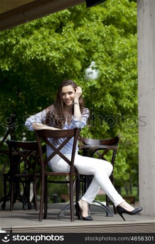 pretty young woman sitting in the cafe