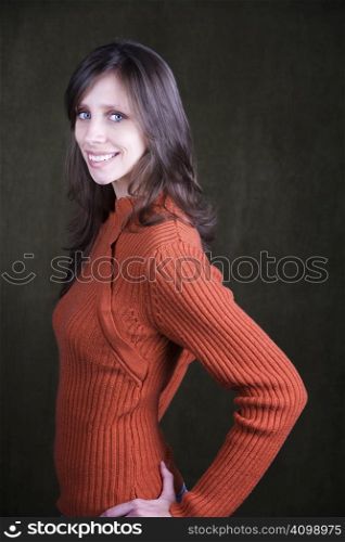 Pretty Young Woman Wearing an Orange Sweater