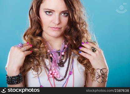 Pretty young woman wearing bracelets rings and many plentiful of precious jewelry necklaces beads. Gorgeous fashion girl.. Pretty woman with jewelry necklaces ring bracelets