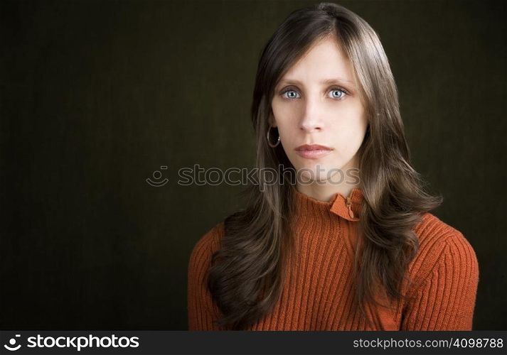 Pretty young woman with a blank expression on her face