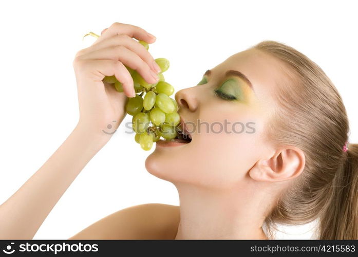 Pretty young woman with grape closeup on the white background